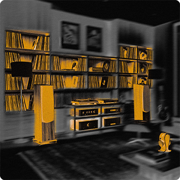 Sala de escucha con estantes de vinilos, bafles y equipos de audio
